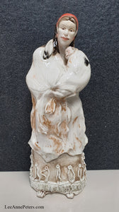 Sculpture - Lady holding a baby