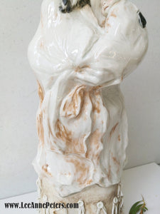Sculpture - Lady holding a baby