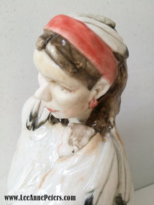 Sculpture - Lady holding a baby